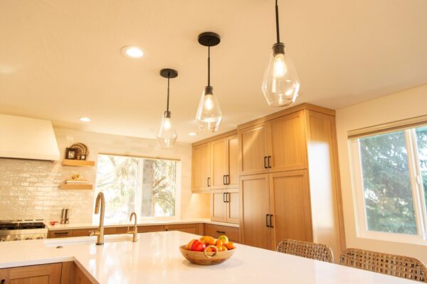 Finished kitchen remodel with new lighting cabinets and tile